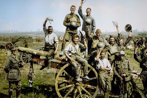 Young men cheering on captured gun