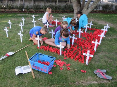 Students laying a field of remembrance.